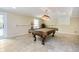 Entertain in this game room with a pool table and neutral walls, perfect for recreation at 10627 Indian Lake S Blvd, Indianapolis, IN 46236
