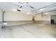 Spacious garage with high ceilings, ample lighting, and epoxy flooring at 10627 Indian Lake S Blvd, Indianapolis, IN 46236