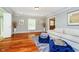 Inviting living room with hardwood floors and light gray walls, exuding warmth and charm at 10627 Indian Lake S Blvd, Indianapolis, IN 46236