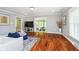 Bright living room features hardwood floors, neutral paint, and an open floor plan at 10627 Indian Lake S Blvd, Indianapolis, IN 46236