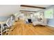 Spacious bedroom featuring vaulted ceilings, exposed beams, and light hardwood floors at 10627 Indian Lake S Blvd, Indianapolis, IN 46236