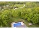 Aerial view of the pool surrounded by mature trees and greenery at 10627 Indian Lake S Blvd, Indianapolis, IN 46236