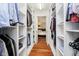 Functional walk-in closet with custom shelving for optimal organization at 10627 Indian Lake S Blvd, Indianapolis, IN 46236
