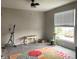 Empty room with large window, exercise equipment, and carpet at 1114 N Olney St, Indianapolis, IN 46201