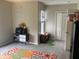Spacious bedroom with neutral carpet, modern light fixture, and closet at 1114 N Olney St, Indianapolis, IN 46201