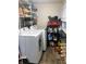 Efficient laundry area with appliances, shelving, and ample storage space at 1114 N Olney St, Indianapolis, IN 46201