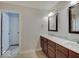 Bathroom with and sinks and tiled backsplash at 11521 Willow Bend Dr, Zionsville, IN 46077