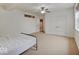 Bedroom with walk-in closet and simple decor, and a carpeted floor at 11521 Willow Bend Dr, Zionsville, IN 46077