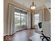 Bedroom with beautiful hardwood floors, large windows, and ample natural light at 11521 Willow Bend Dr, Zionsville, IN 46077