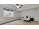 Bright bedroom with large window and a simple metal bed frame at 11521 Willow Bend Dr, Zionsville, IN 46077