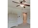 Bright bedroom with a large dresser, neutral carpet, and ceiling fan at 11521 Willow Bend Dr, Zionsville, IN 46077