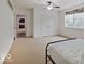 Bedroom with walk-in closet and simple decor, and a carpeted floor at 11521 Willow Bend Dr, Zionsville, IN 46077