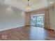 Spacious bedroom featuring hardwood floors, recessed lights, and a sliding door to the outside at 11521 Willow Bend Dr, Zionsville, IN 46077