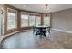Bright dining room with large windows offering views of the landscaped yard at 11521 Willow Bend Dr, Zionsville, IN 46077