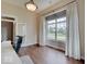 Bright home office with hardwood floors and abundant natural light from large window at 11521 Willow Bend Dr, Zionsville, IN 46077