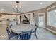 Kitchen view featuring large island, stainless appliances, and view into dining area at 11521 Willow Bend Dr, Zionsville, IN 46077