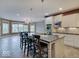 Bright, airy kitchen featuring a large island with seating, stainless appliances, and tile floors at 11521 Willow Bend Dr, Zionsville, IN 46077