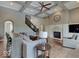 Comfortable living room features coffered ceilings, fireplace, and access to a staircase and other living areas at 11521 Willow Bend Dr, Zionsville, IN 46077