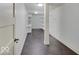 Well-lit pantry with dark tile flooring and white shelving for ample storage at 11521 Willow Bend Dr, Zionsville, IN 46077