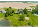 Aerial view of the estate showcasing lush landscaping, pond, garden, and manicured lawns at 11705 N Shelby 700 W, New Palestine, IN 46163