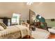 Spacious bedroom featuring a four-poster bed and cozy sitting area at 11705 N Shelby 700 W, New Palestine, IN 46163