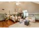 Bedroom with vaulted ceilings, hardwood floors, and comfortable seating at 11705 N Shelby 700 W, New Palestine, IN 46163
