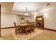 Basement dining room with fireplace, a table, seating for eight, and exercise area at 11705 N Shelby 700 W, New Palestine, IN 46163