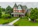 View of this Victorian home with mature landscaping, stone walkway, and manicured lawn at 11705 N Shelby 700 W, New Palestine, IN 46163