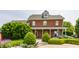 Charming two-story brick home with a covered front porch and meticulously manicured landscaping at 11705 N Shelby 700 W, New Palestine, IN 46163