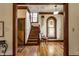 Foyer featuring detailed trim, hardwood floors, stained glass and an elegant staircase at 11705 N Shelby 700 W, New Palestine, IN 46163