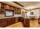 Gourmet kitchen featuring stainless steel appliances, wooden cabinetry, and abundant natural light at 11705 N Shelby 700 W, New Palestine, IN 46163