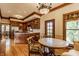 View of kitchen with wood cabinetry, stainless appliances, and adjacent dining area with ornate table at 11705 N Shelby 700 W, New Palestine, IN 46163
