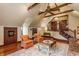 Spacious living room featuring a unique ceiling, wood floors, comfortable seating, and a wooden staircase at 11705 N Shelby 700 W, New Palestine, IN 46163