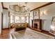 Elegant main bedroom with hardwood floors, decorative fireplace, chandelier and lots of natural light at 11705 N Shelby 700 W, New Palestine, IN 46163