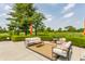 Inviting patio area features comfortable seating, perfect for enjoying the serene golf course views at 11705 N Shelby 700 W, New Palestine, IN 46163