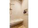 Elegant shower with white subway tile, marble bench, and built-in niche at 11705 N Shelby 700 W, New Palestine, IN 46163