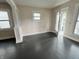 Bright living area with dark hardwood floors, featuring natural light and a classic layout at 1247 Wright St, Indianapolis, IN 46203