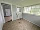 Enclosed sunroom with multiple windows providing abundant natural light at 1247 Wright St, Indianapolis, IN 46203