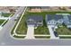 Overhead view of a residential area with newly constructed homes, manicured lawns, and ample parking at 13887 N Hawkers Hill Dr, Camby, IN 46113