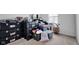 Unfinished basement with stacked storage bins and household items at 13887 N Hawkers Hill Dr, Camby, IN 46113