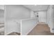 Upstairs hallway featuring neutral walls and carpet, leading to other rooms of the home at 13887 N Hawkers Hill Dr, Camby, IN 46113