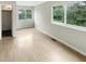 Bright bedroom with wood floor and two windows at 1464 Scarlett Ct, Franklin, IN 46131