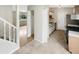 Well-lit kitchen with tiled floor, stainless steel refrigerator, and white cabinets at 1464 Scarlett Ct, Franklin, IN 46131