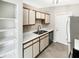 Functional kitchen with modern appliances, plenty of cabinet space, and a double sink at 1464 Scarlett Ct, Franklin, IN 46131