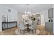 Elegant dining area with a round table, seating for six, and views of the modern kitchen at 14866 E Keenan Cir # Lot 38, Westfield, IN 46074