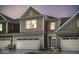 Charming home exterior boasts stone and siding accents, showcasing a welcoming facade and attached garages at 14866 E Keenan Cir # Lot 38, Westfield, IN 46074