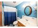Comfortable bathroom features blue walls and a shower and tub combo at 1602 Queensbridge Sq # 7, Indianapolis, IN 46219