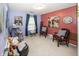 Bright bedroom featuring blue and pink walls, carpeted floors and natural light at 1602 Queensbridge Sq # 7, Indianapolis, IN 46219