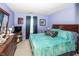 Bedroom featuring blue walls, ceiling fan and a window with curtains at 1602 Queensbridge Sq # 7, Indianapolis, IN 46219