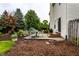Well-maintained backyard with a patio, landscaped garden, and access to the house through sliding glass doors at 16126 Etna Green, Westfield, IN 46074